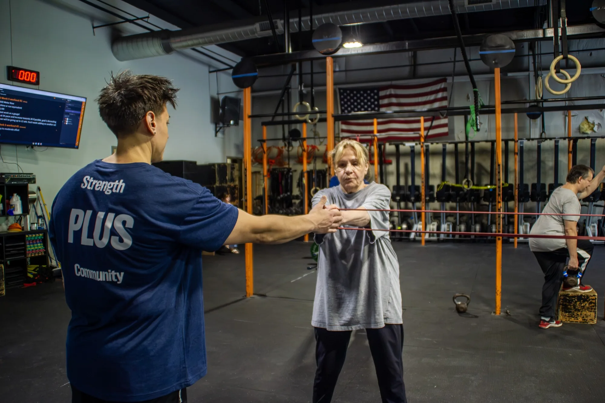 Doctor of Physical Therapy Jen Ciardulli gives hands-on coaching to a client at Top Form Physical Therapy, Branford CT